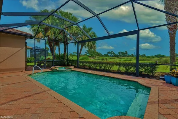 a bedroom with a bed and a potted plant