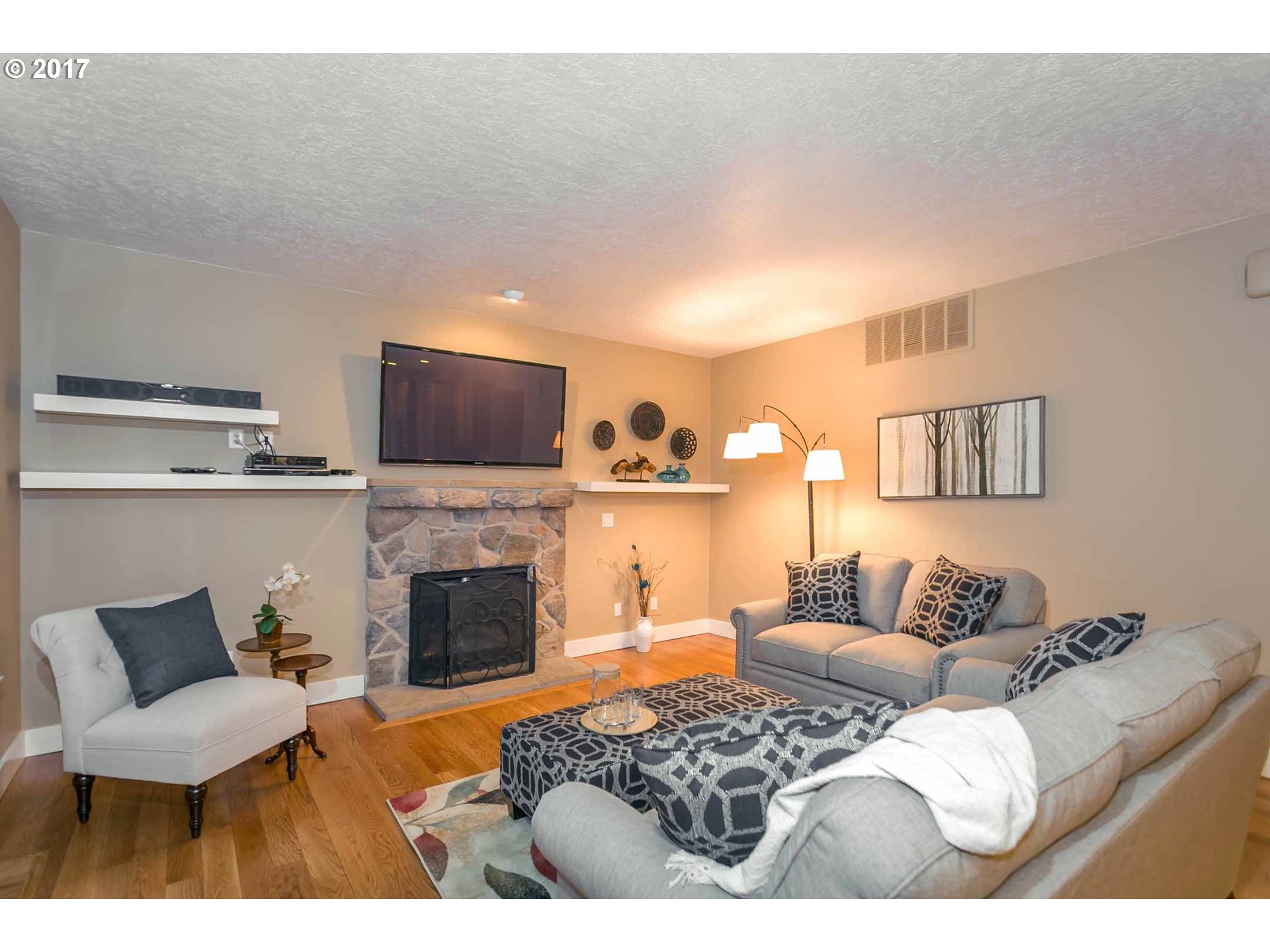 14525 Southeast Duke Street Portland, OR 97236 - Photo 14 of 27 a bedroom with furniture and a fireplace