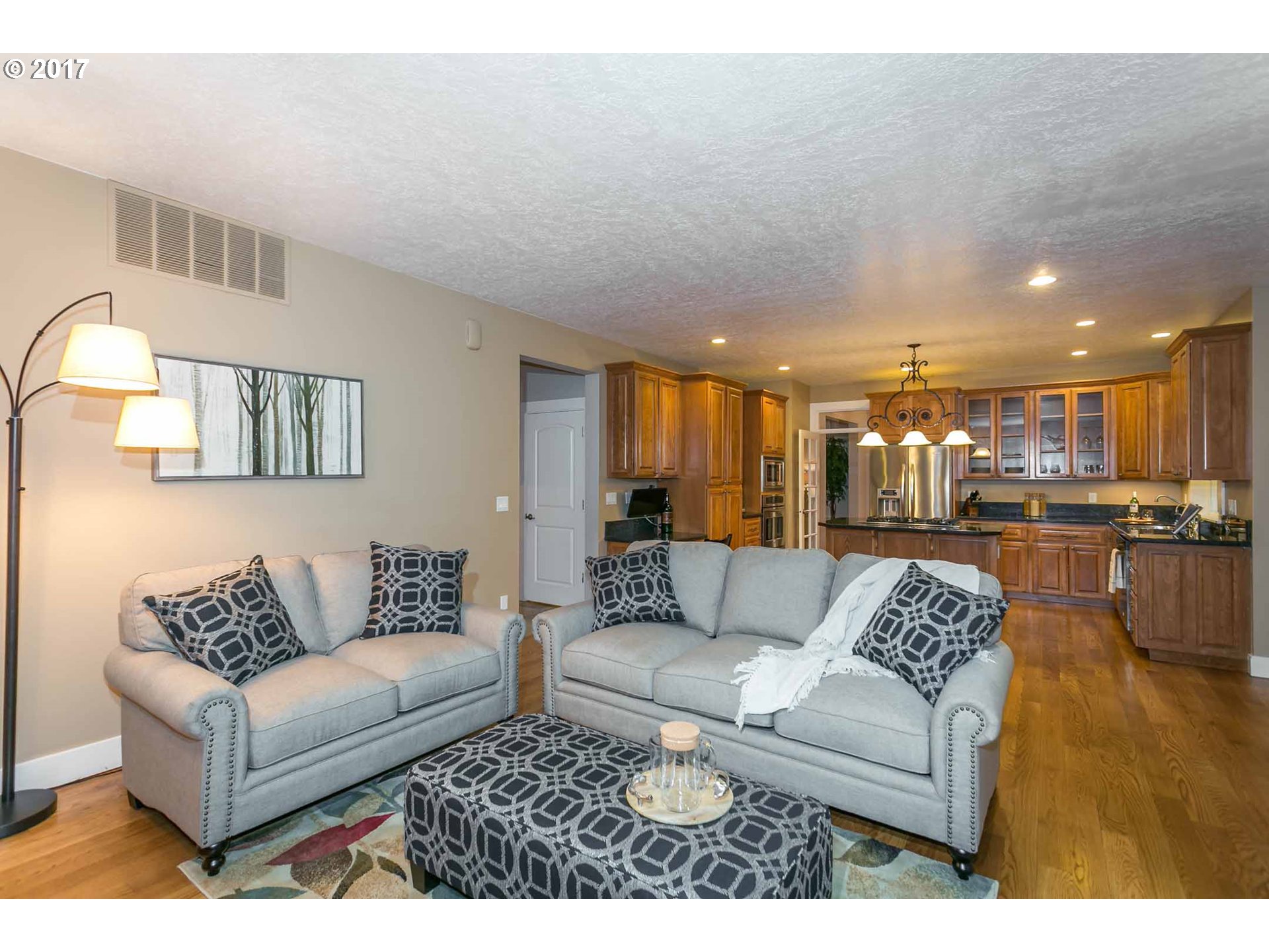 14525 Southeast Duke Street Portland, OR 97236 - Photo 15 of 27 a living room with furniture and kitchen view