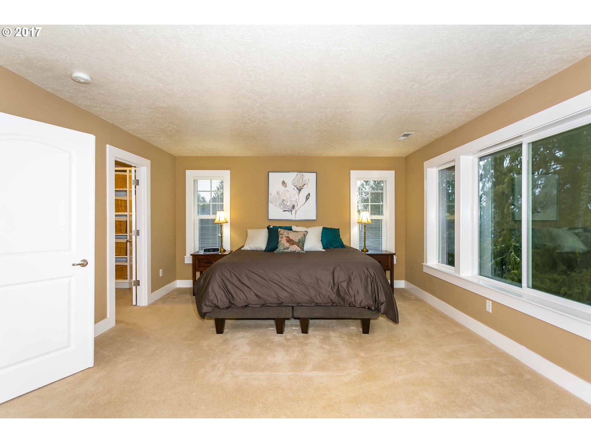 14525 Southeast Duke Street Portland, OR 97236 - Photo 18 of 27 a living room with a large bed and a large window