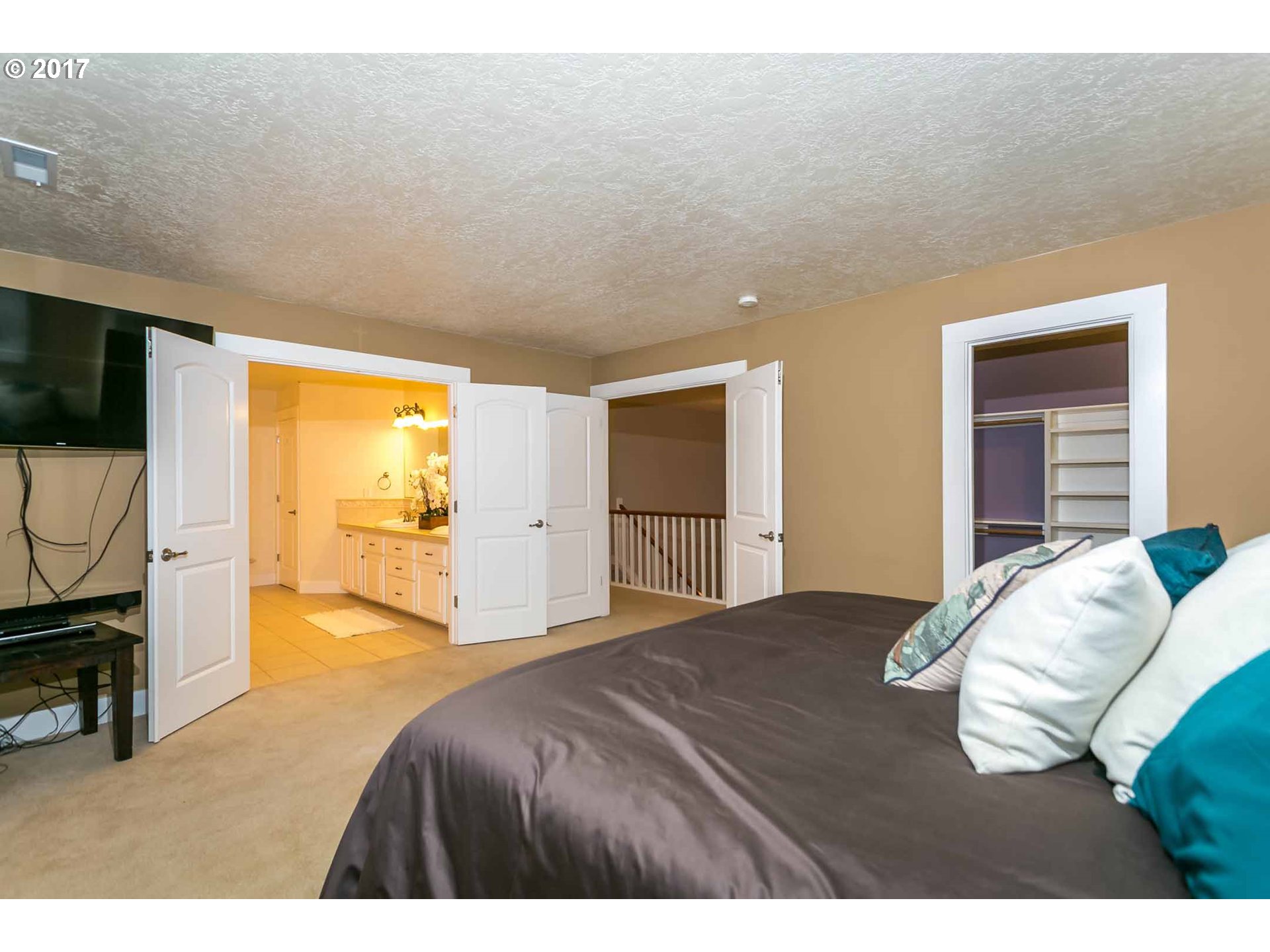 14525 Southeast Duke Street Portland, OR 97236 - Photo 19 of 27 a bedroom with a bed and flat screen tv