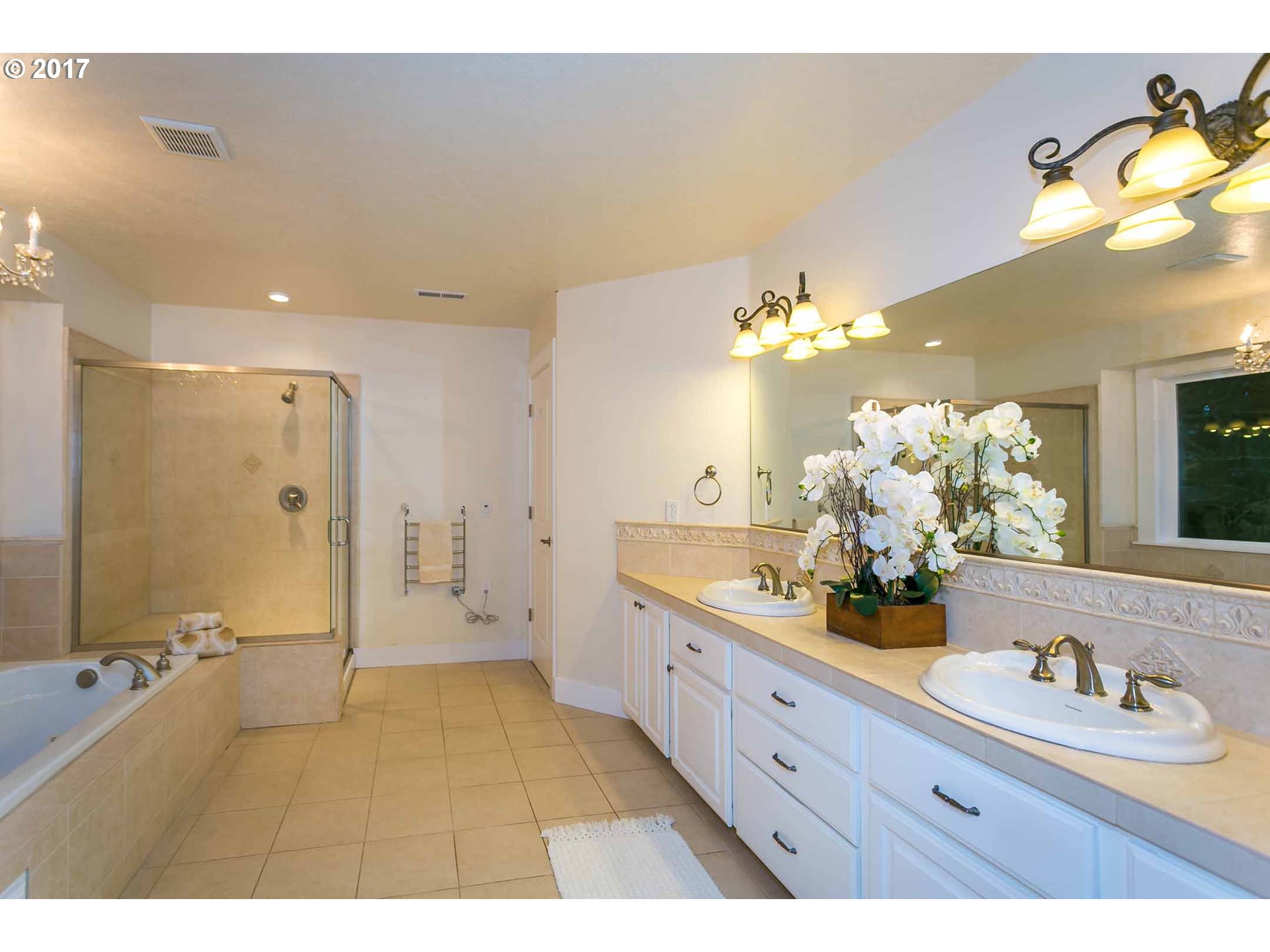 14525 Southeast Duke Street Portland, OR 97236 - Photo 20 of 27 a bathroom with a double vanity sink mirror and shower