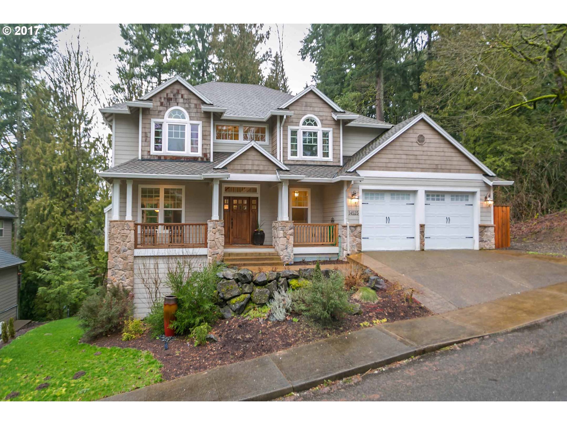 14525 Southeast Duke Street Portland, OR 97236 - Photo 2 of 27 a front view of a house with a garden and porch