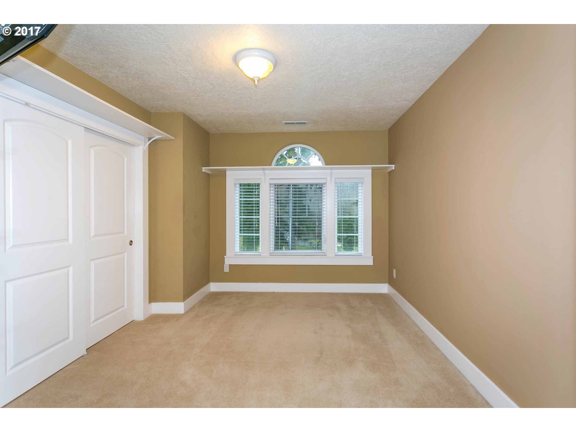 14525 Southeast Duke Street Portland, OR 97236 - Photo 22 of 27 a view of an empty room with a window