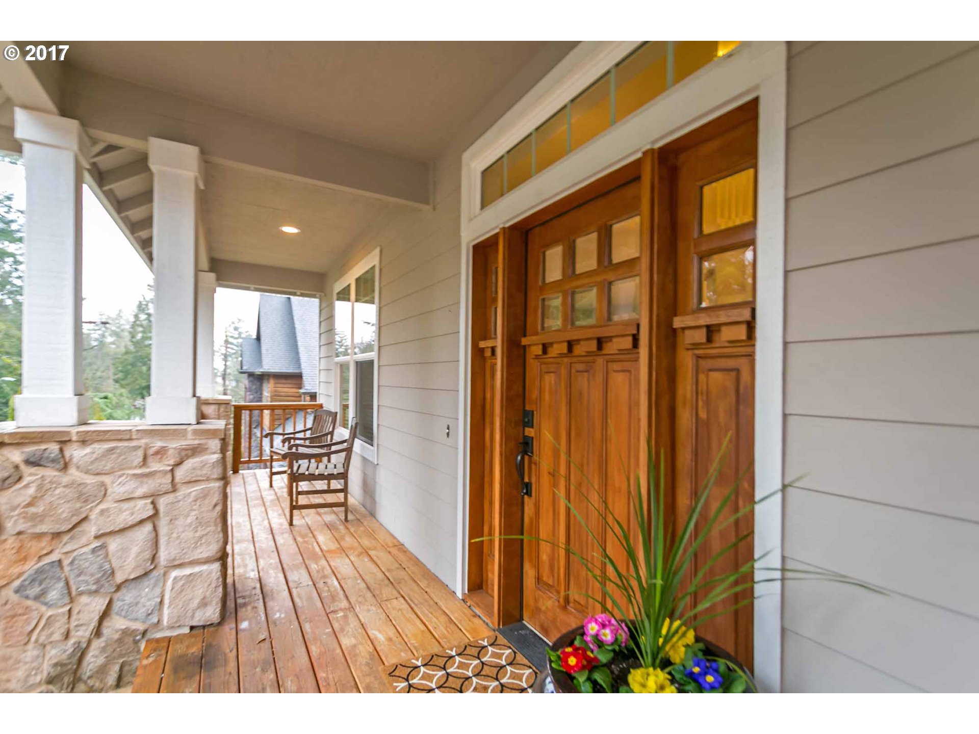 14525 Southeast Duke Street Portland, OR 97236 - Photo 4 of 27 a view of a porch with chairs and backyard of a house