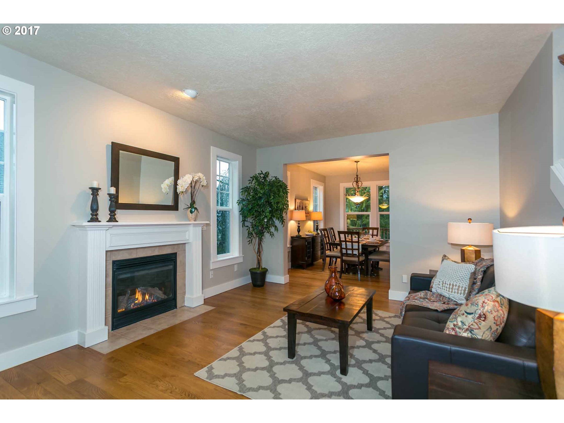 14525 Southeast Duke Street Portland, OR 97236 - Photo 6 of 27 a living room with furniture and a fireplace