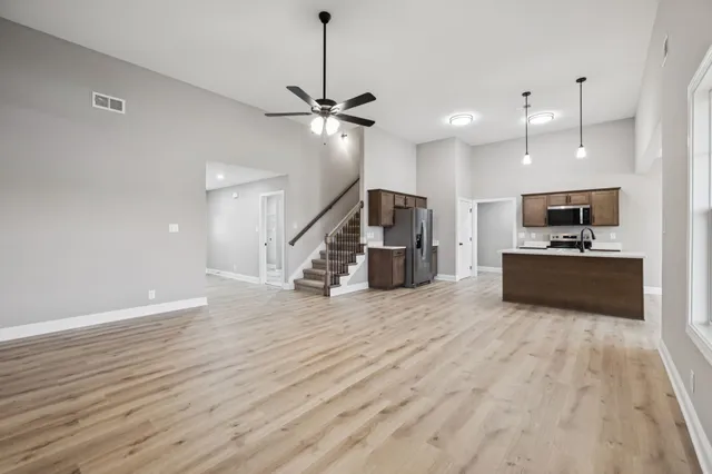 a view of kitchen with sink microwave and stove