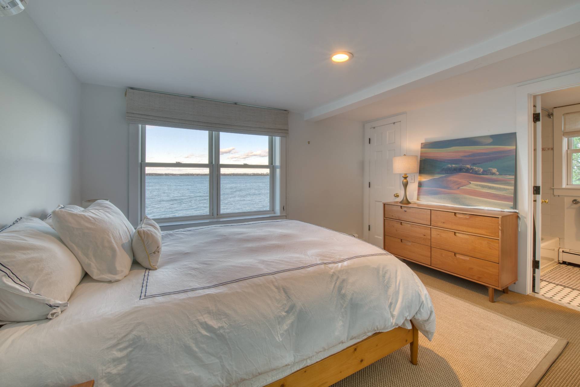 3675 Noyack Road Sag Harbor, NY 11963 - Photo 6 of 12 a bedroom with a bed and a dresser