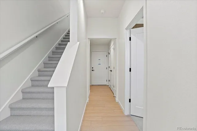 a view of a hallway with stairs