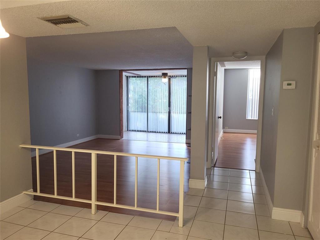 3720 Inverrary Drive, Unit 2I Lauderhill, FL 33319 - Photo 10 of 22 Living room hall way 3720