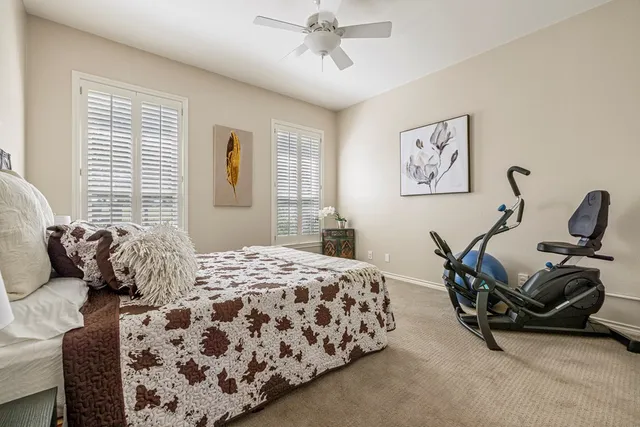 a bedroom with bed and a window