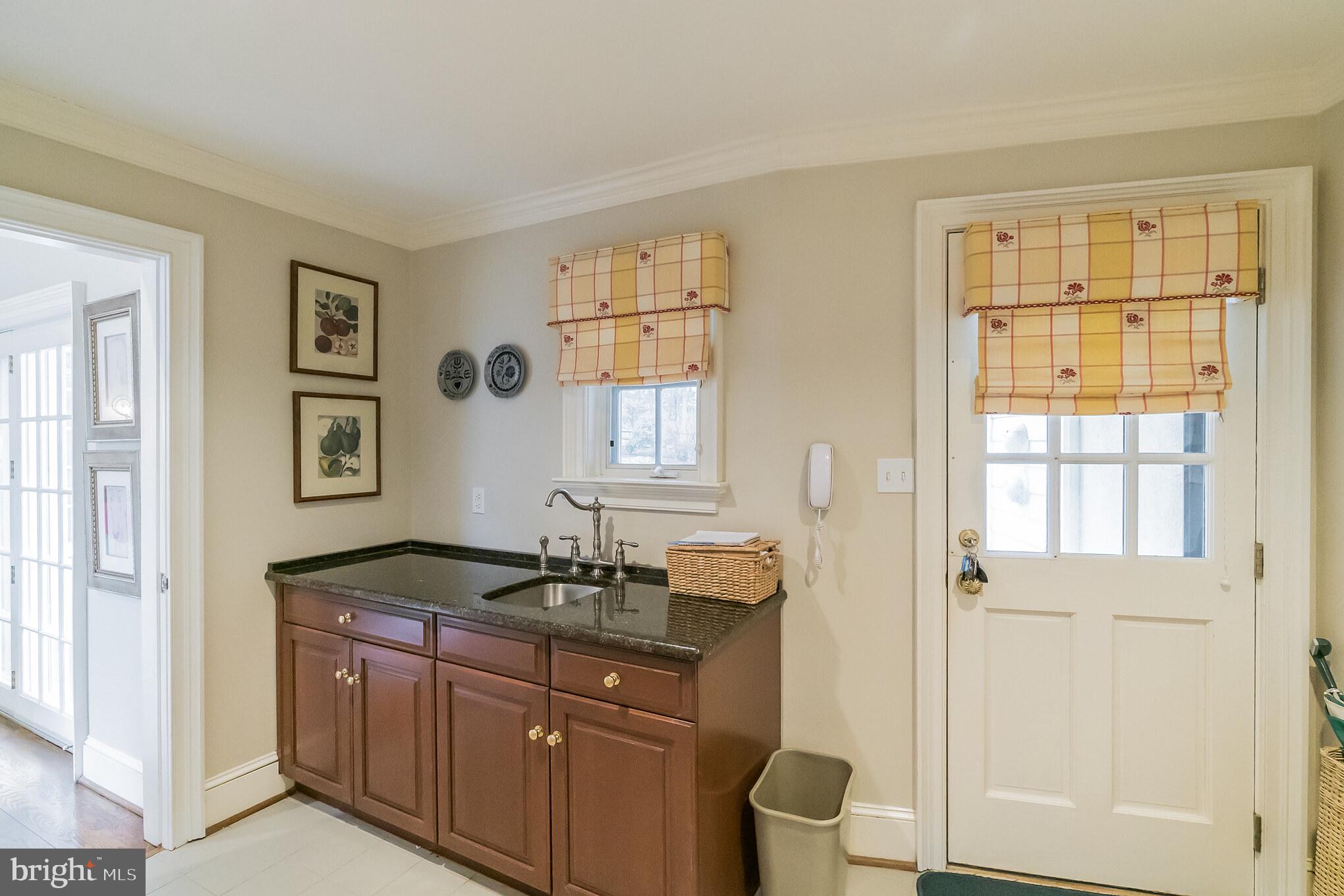 1 Sugarbrook Road Malvern, PA 19355 - Photo 25 of 56 1st floor mudroom with wet bar.