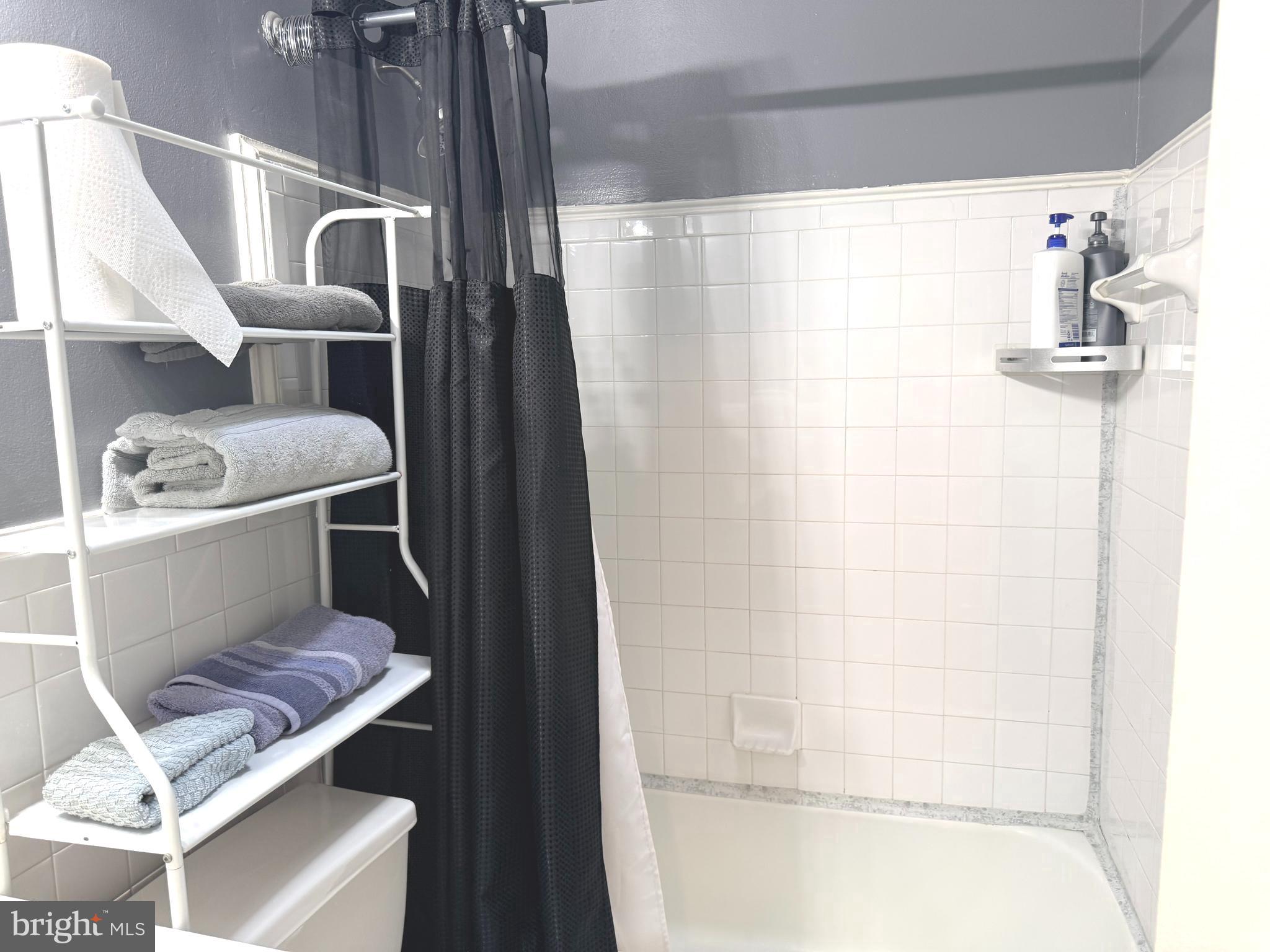 7820 Wynbrook Road Baltimore, MD 21224 - Photo 12 of 18 a bathroom with a sink a toilet and shower