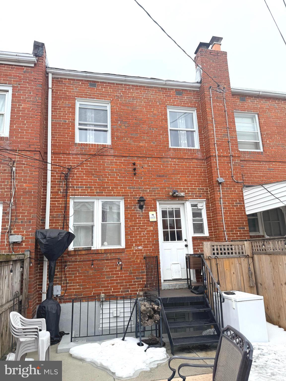 7820 Wynbrook Road Baltimore, MD 21224 - Photo 18 of 18 a front view of a house with a yard