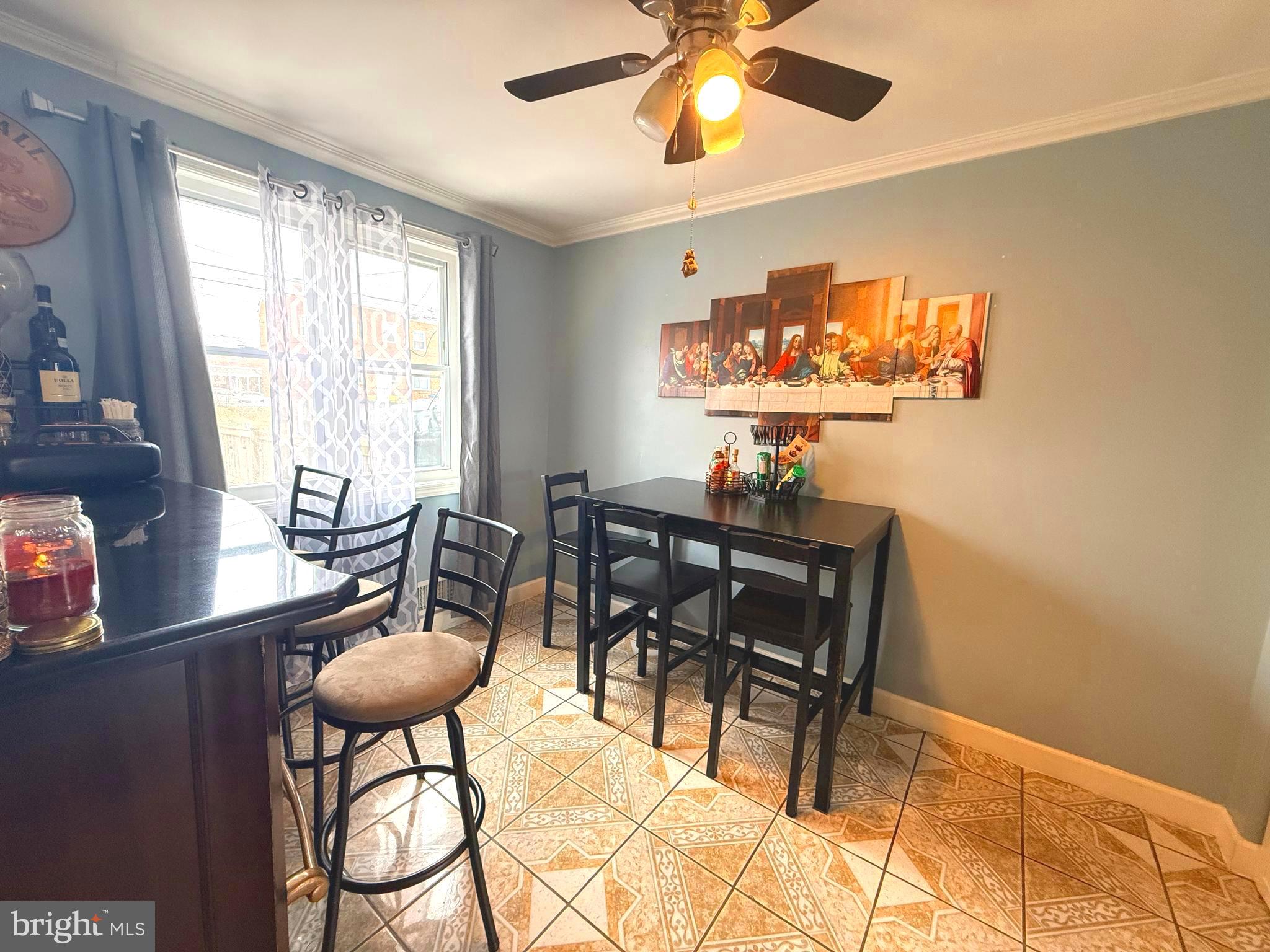 7820 Wynbrook Road Baltimore, MD 21224 - Photo 3 of 18 a view of a dining room with furniture window and outside view