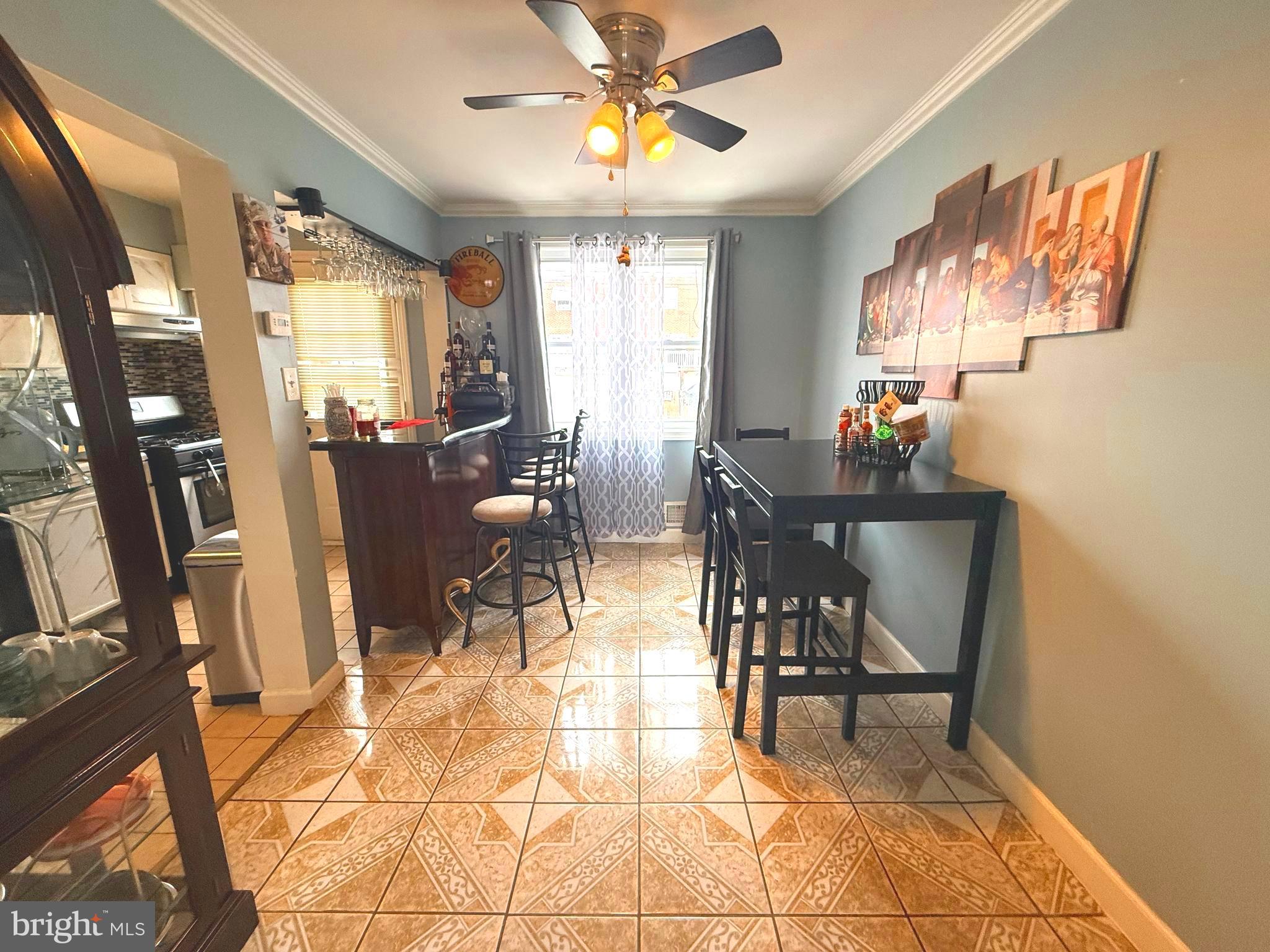 7820 Wynbrook Road Baltimore, MD 21224 - Photo 4 of 18 a view of a dining room with furniture and chandelier