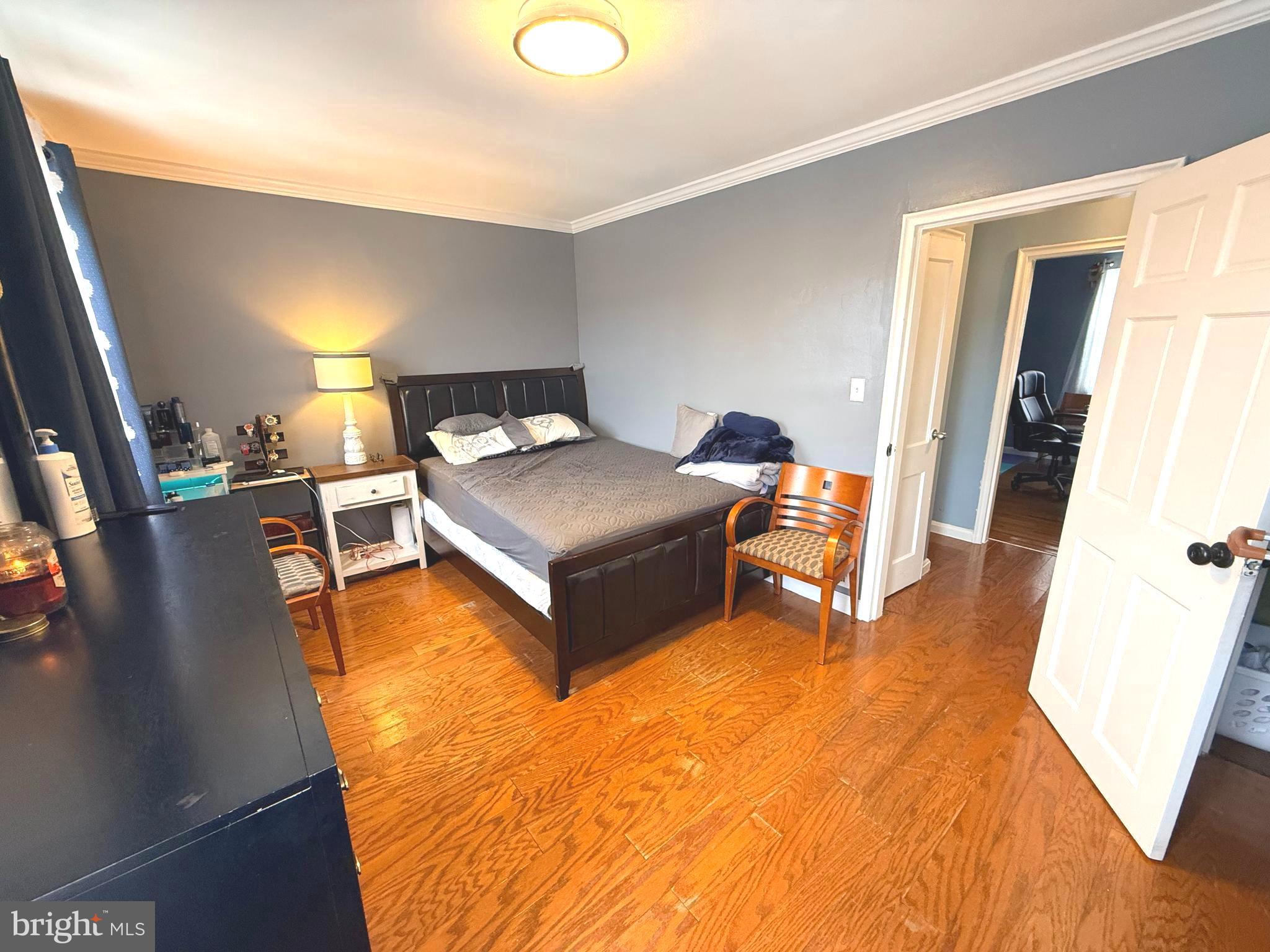 7820 Wynbrook Road Baltimore, MD 21224 - Photo 8 of 18 a living room with furniture and a wooden floor