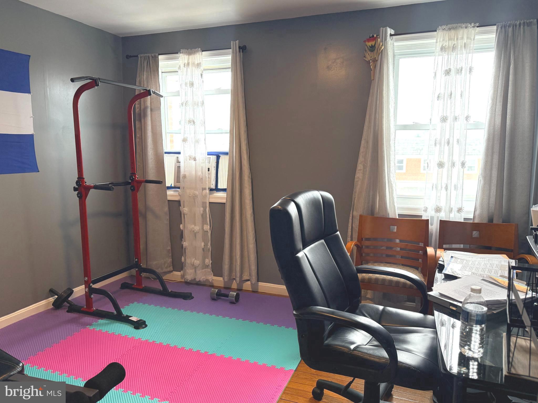 7820 Wynbrook Road Baltimore, MD 21224 - Photo 10 of 18 a view of a workspace with furniture and a window