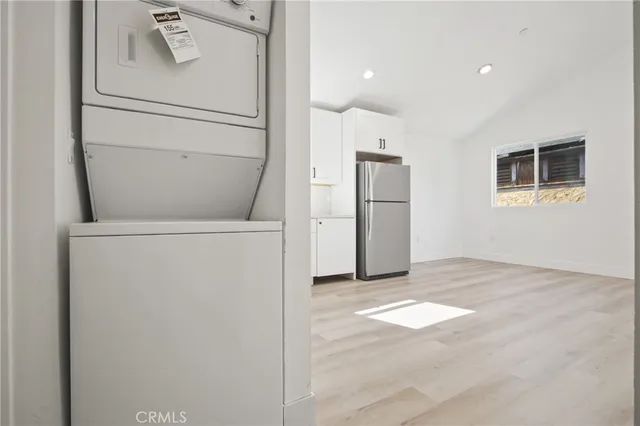 a view of a kitchen with a fridge