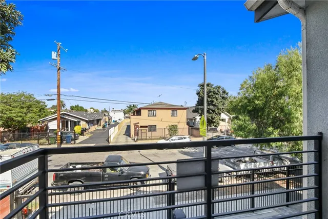 a view of a balcony with two windows