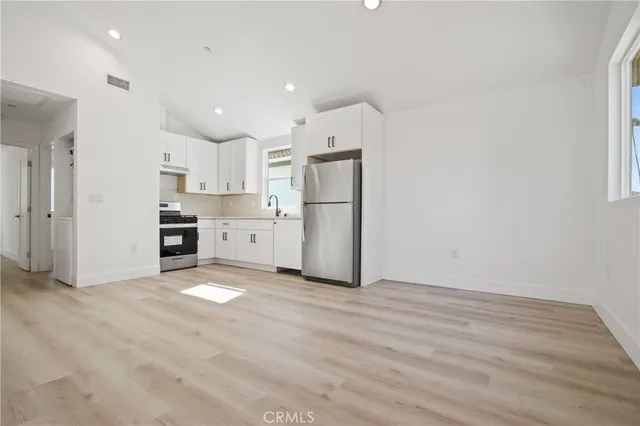 a view of kitchen with wooden floor