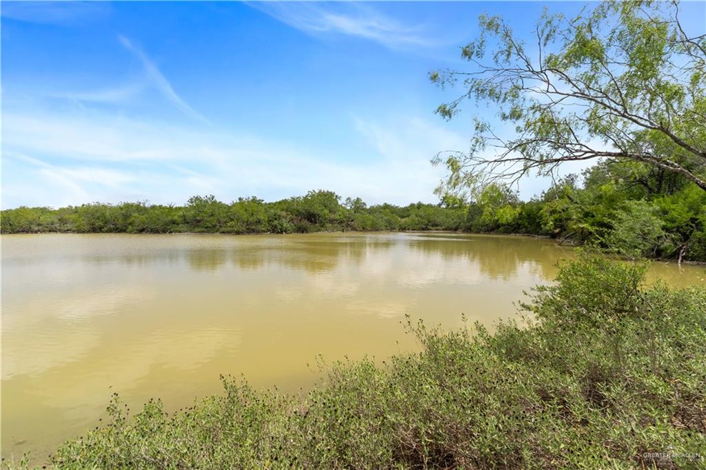 0 Military Road Penitas, TX 78576 - Photo 10 of 26 a view of a lake with houses in the back