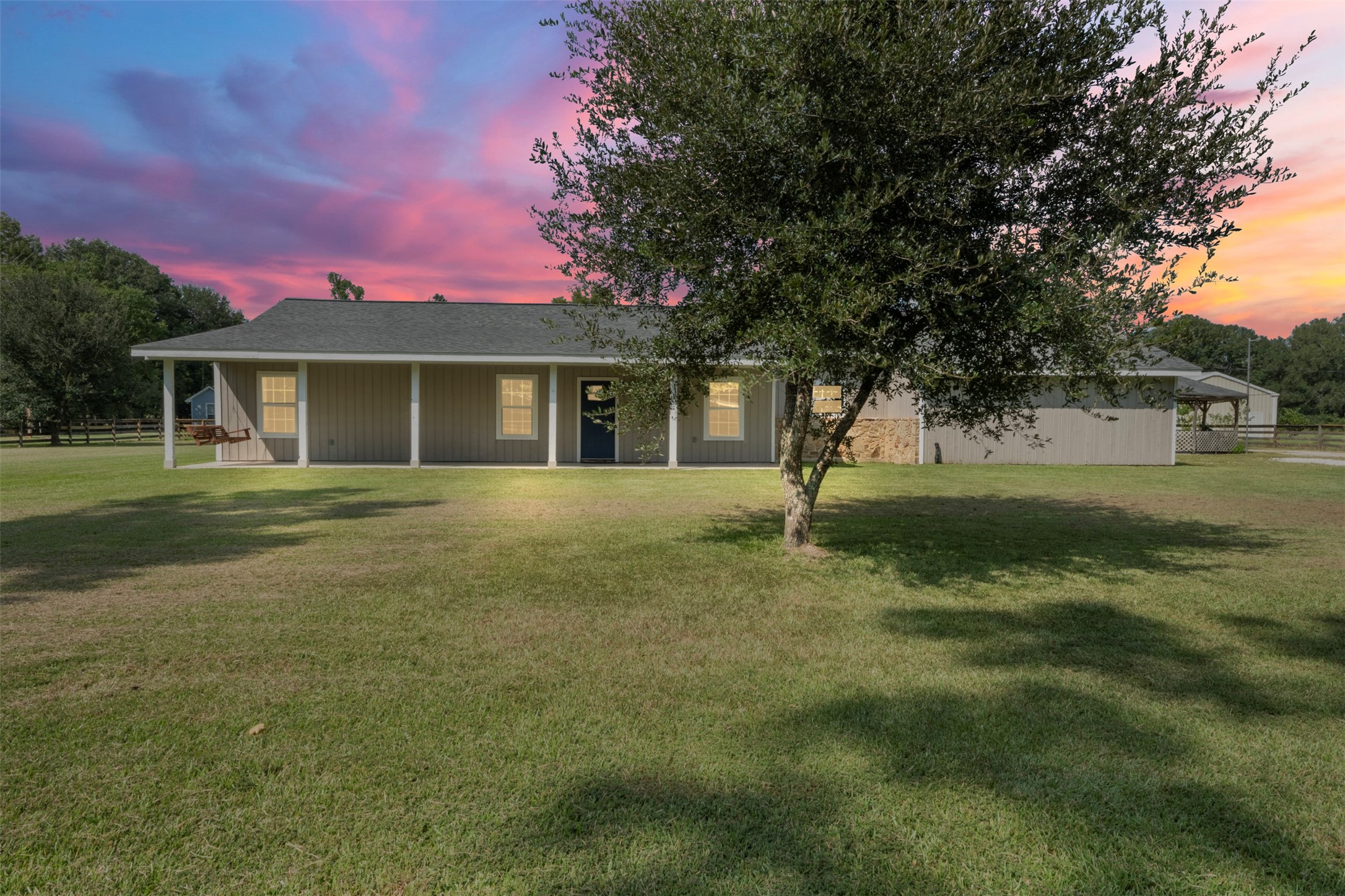 28081 Ivy Oaks Lane Splendora, TX 77372 - Photo 26 of 27 a view of a house with a yard