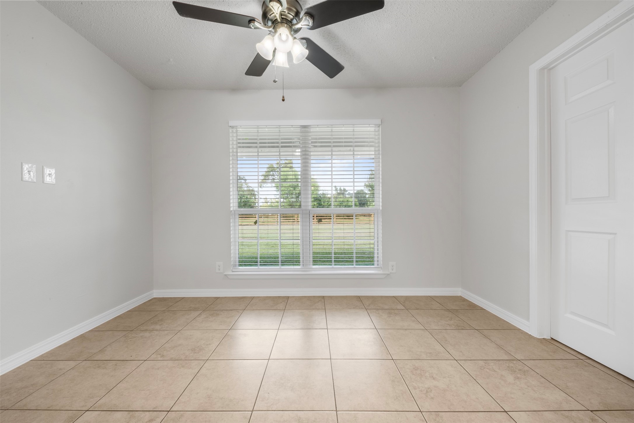 28081 Ivy Oaks Lane Splendora, TX 77372 - Photo 7 of 27 a view of an empty room with a window