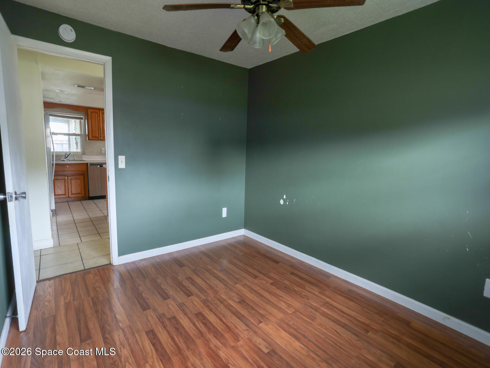 2375 Ricky Road Melbourne, FL 32935 - Photo 13 of 41 a view of empty room with wooden floor