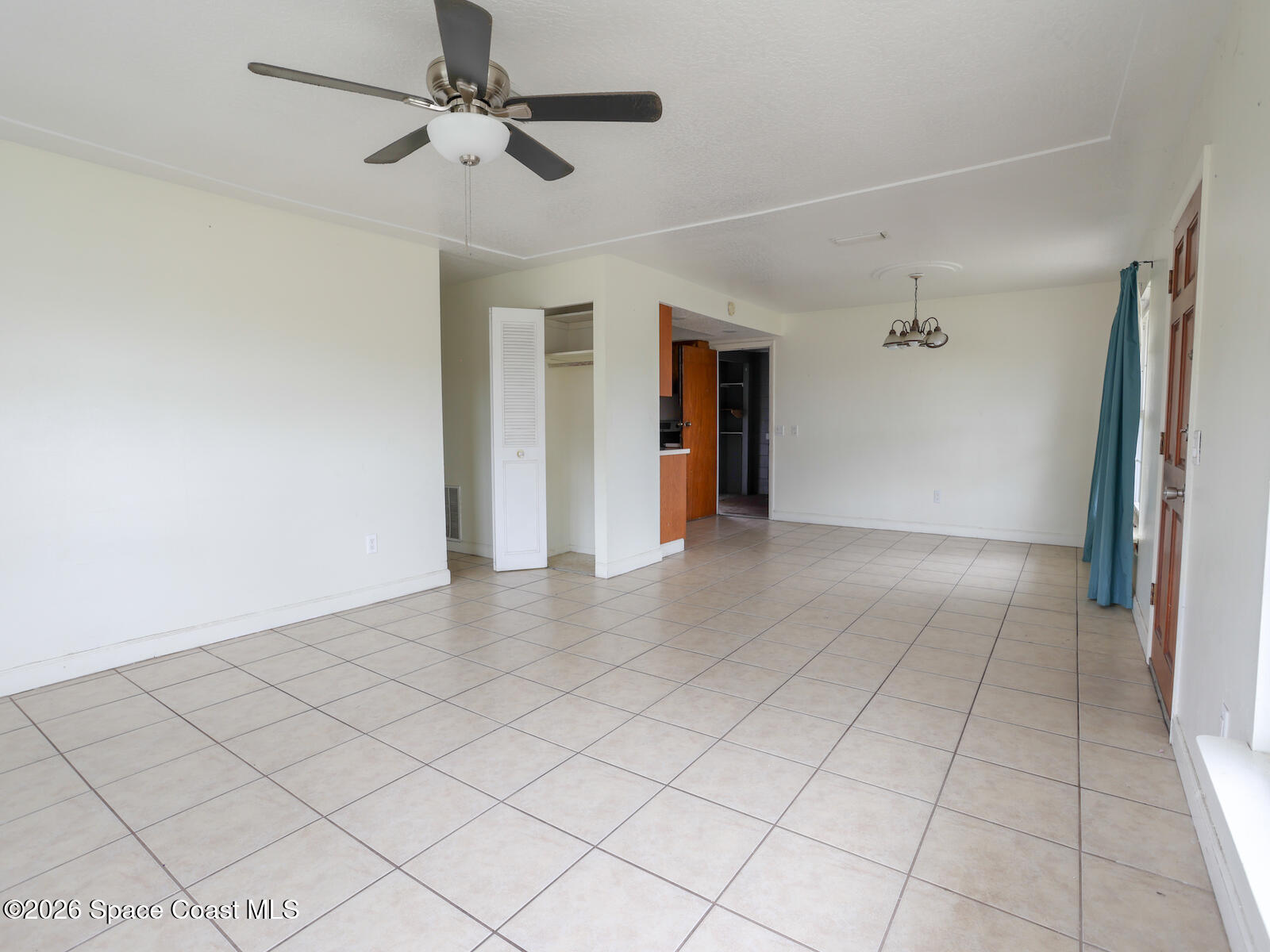 2375 Ricky Road Melbourne, FL 32935 - Photo 27 of 41 a view of an empty room and a ceiling fan window
