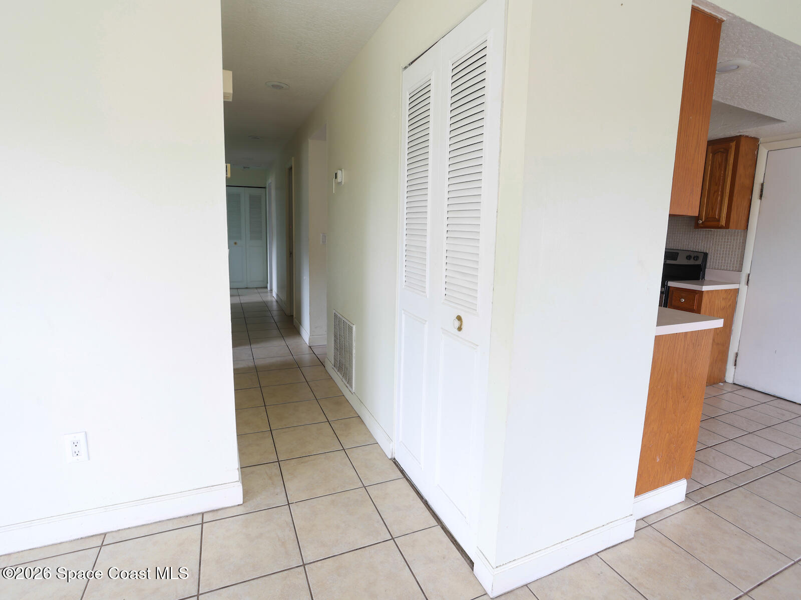 2375 Ricky Road Melbourne, FL 32935 - Photo 8 of 41 a view of a kitchen from the hallway