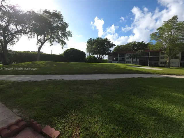 a view of a golf course with a lake