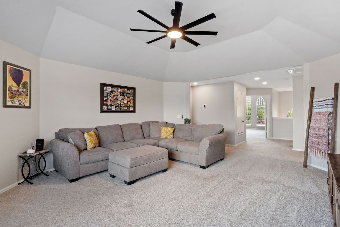 154 Larch Cove Kyle, TX 78640 - Photo 14 of 25 a living room with furniture and a ceiling fan
