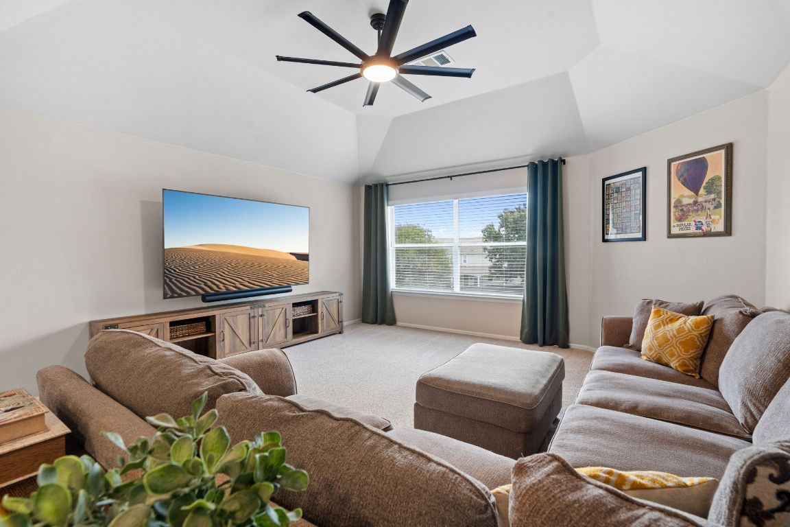 154 Larch Cove Kyle, TX 78640 - Photo 15 of 25 a living room with furniture and a flat screen tv