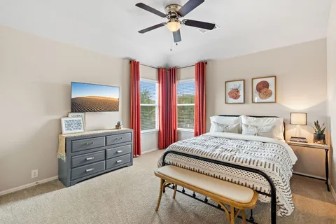 a bedroom with a bed and a dresser