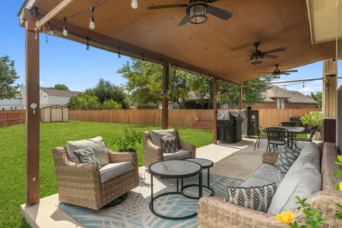 a view of a patio with couches and a table