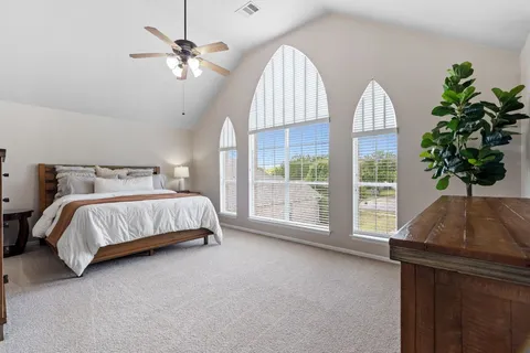 a bedroom with bed and a window