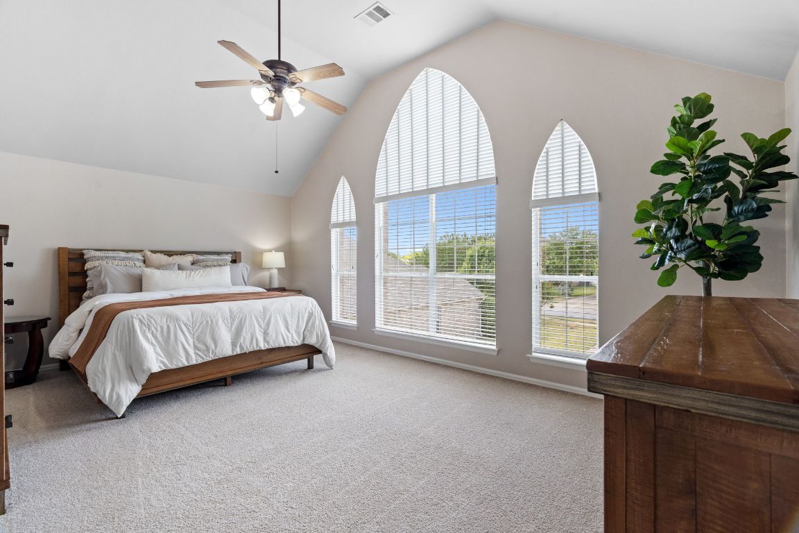 154 Larch Cove Kyle, TX 78640 - Photo 10 of 25 a bedroom with bed and a window