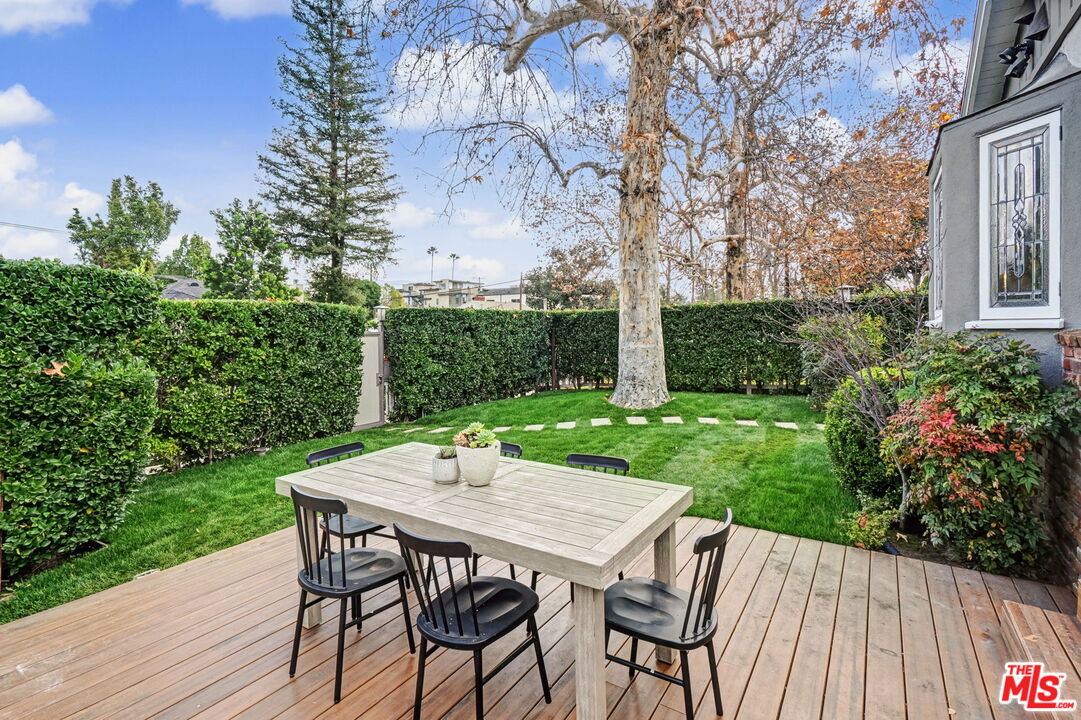 5009 Willowcrest Avenue North Hollywood, CA 91601 - Photo 18 of 61 a view of a backyard with table and chairs and potted plants