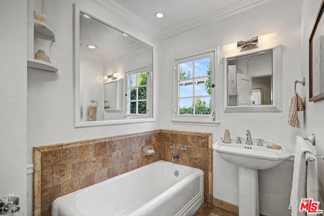5009 Willowcrest Avenue North Hollywood, CA 91601 - Photo 31 of 61 a bathroom with a bathtub and a sink