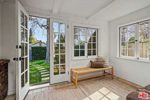 a living room with furniture fireplace and window