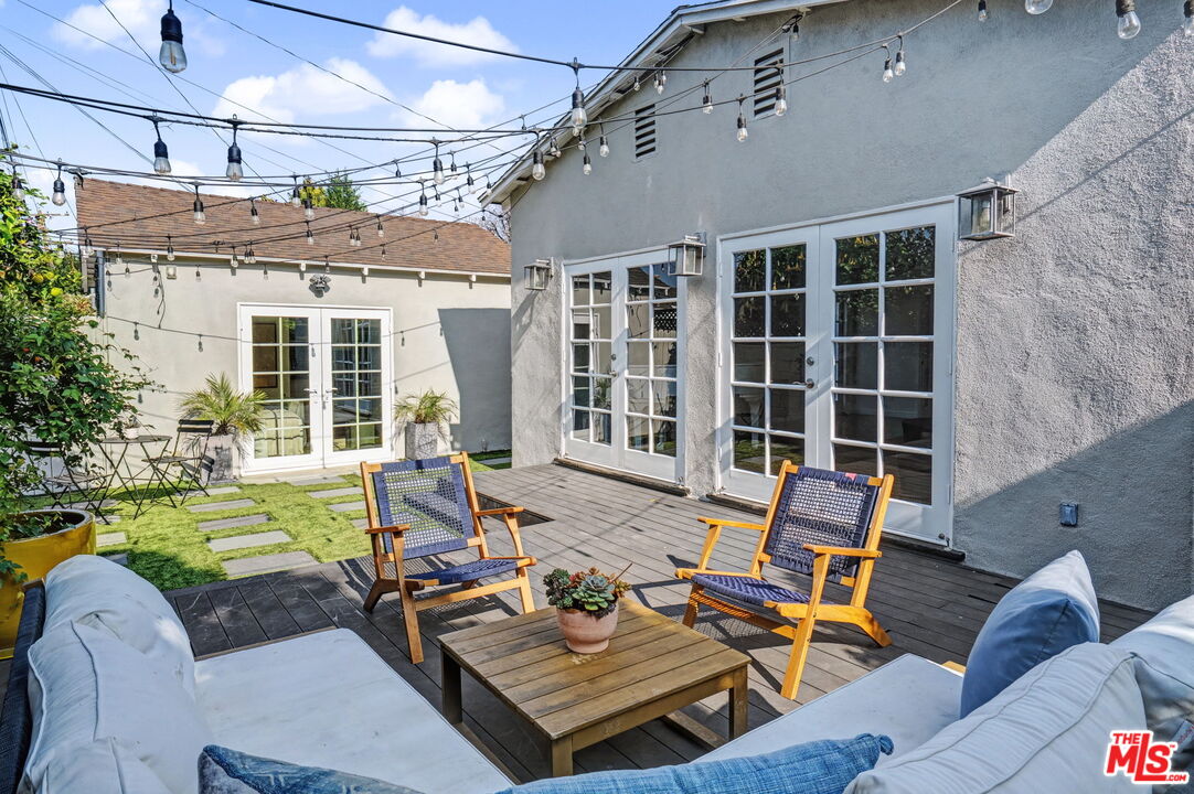 5009 Willowcrest Avenue North Hollywood, CA 91601 - Photo 48 of 61 a view of a patio with couches table and chairs and potted plants