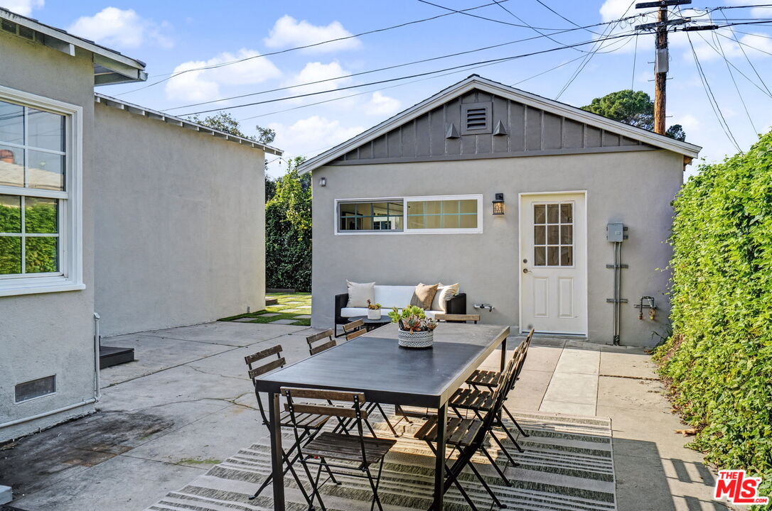 5009 Willowcrest Avenue North Hollywood, CA 91601 - Photo 57 of 61 a backyard of a house with table and chairs