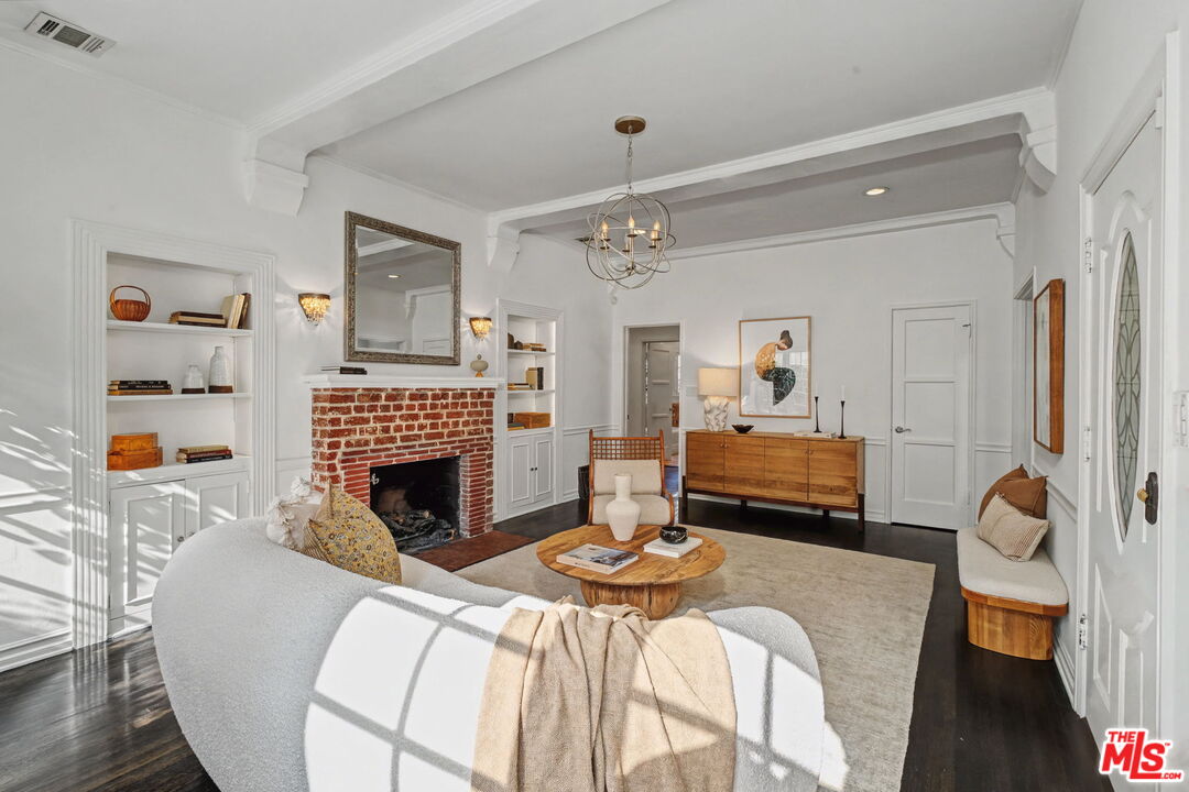 5009 Willowcrest Avenue North Hollywood, CA 91601 - Photo 8 of 61 a bedroom with a bed and a fireplace