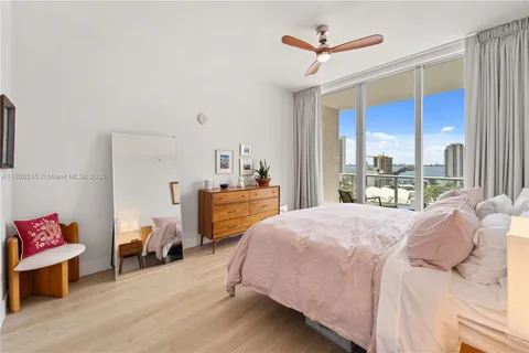 a bed room with a bed and a window