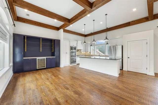 a living room with fireplace furniture and a flat screen tv