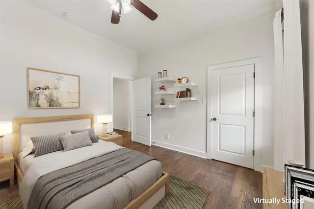 an empty room with ceiling fan and windows