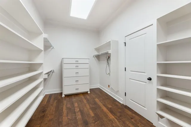 a spacious bedroom with a large bed and a couch