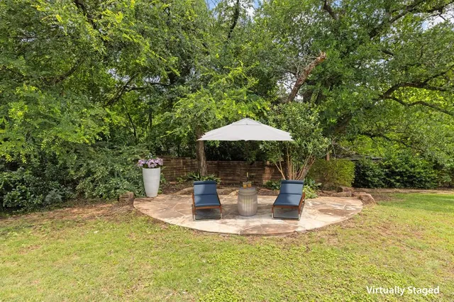 a outdoor space with a table and chairs