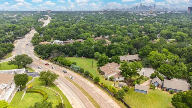 an aerial view of lake residential houses with outdoor space and swimming pool